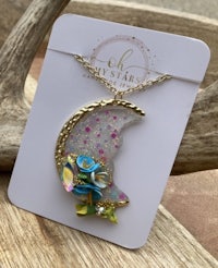a necklace with a flower on it